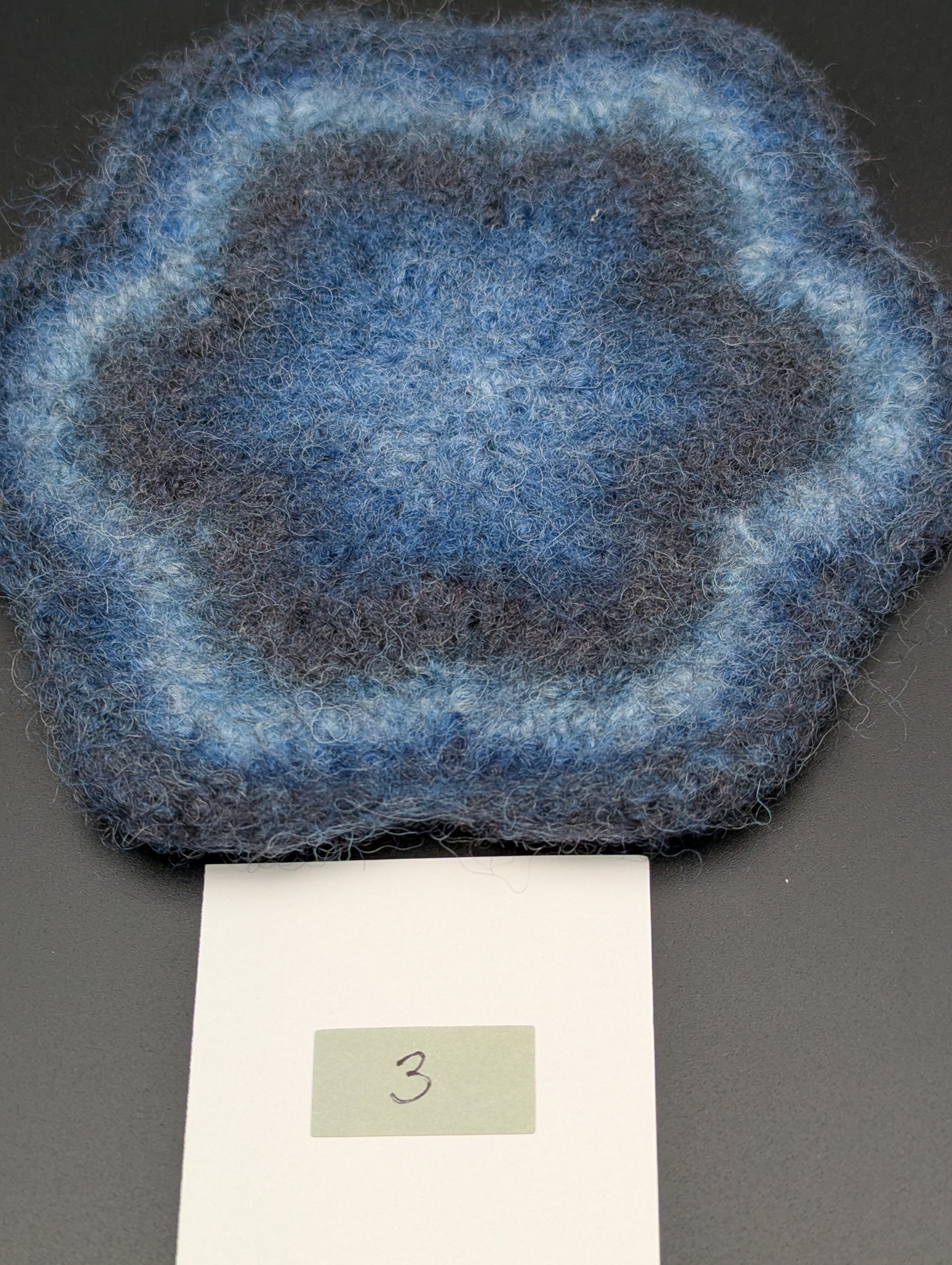 Blue hand knitted and felted coaster. This coaster is number 3.