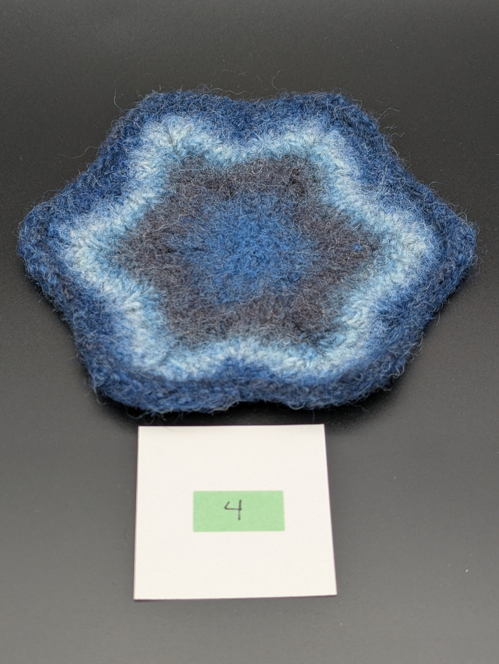 Blue hand knitted and felted coaster. This coaster is number 4.