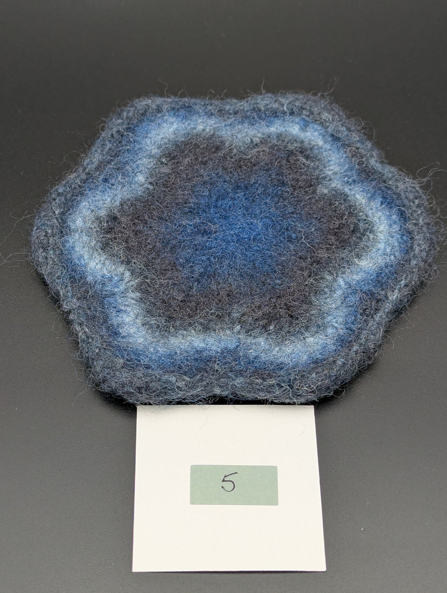 Blue hand knitted and felted coaster. This coaster is number 5.