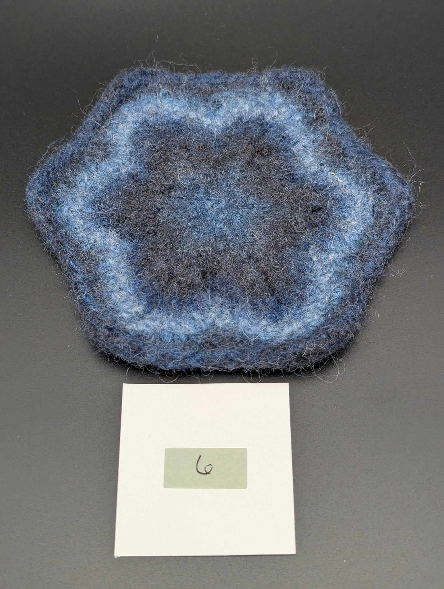 Blue hand knitted and felted coaster. This coaster is number 6.