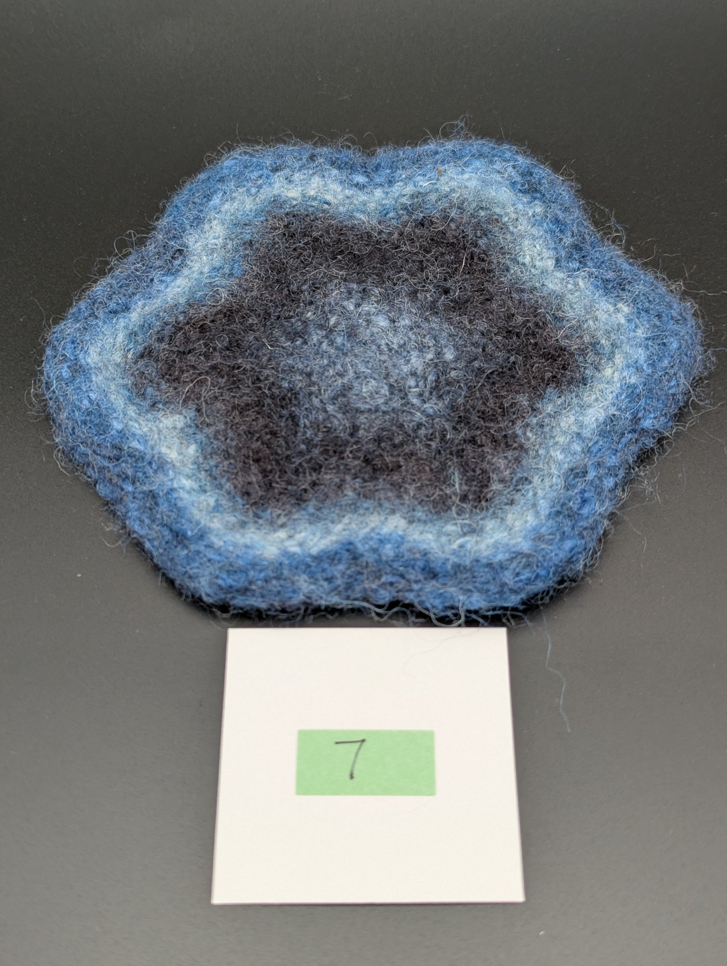 Blue hand knitted and felted coaster. This coaster is number 7.