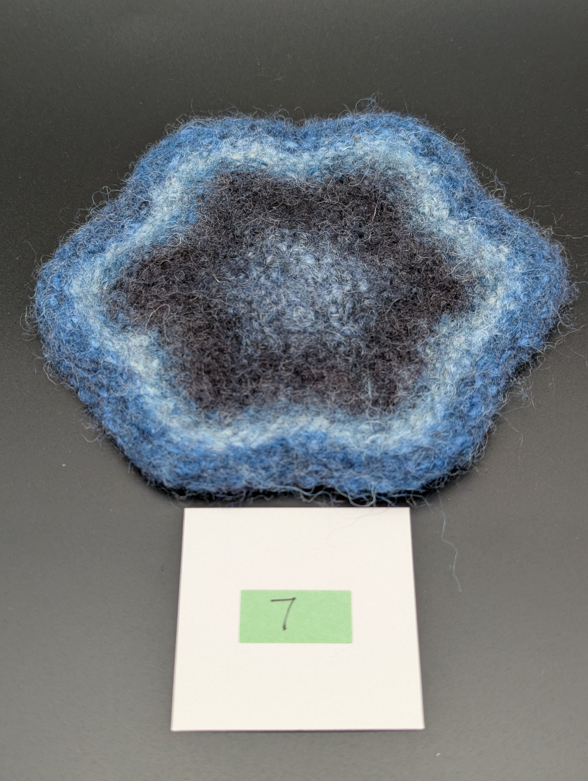 Blue hand knitted and felted coaster. This coaster is number 7.