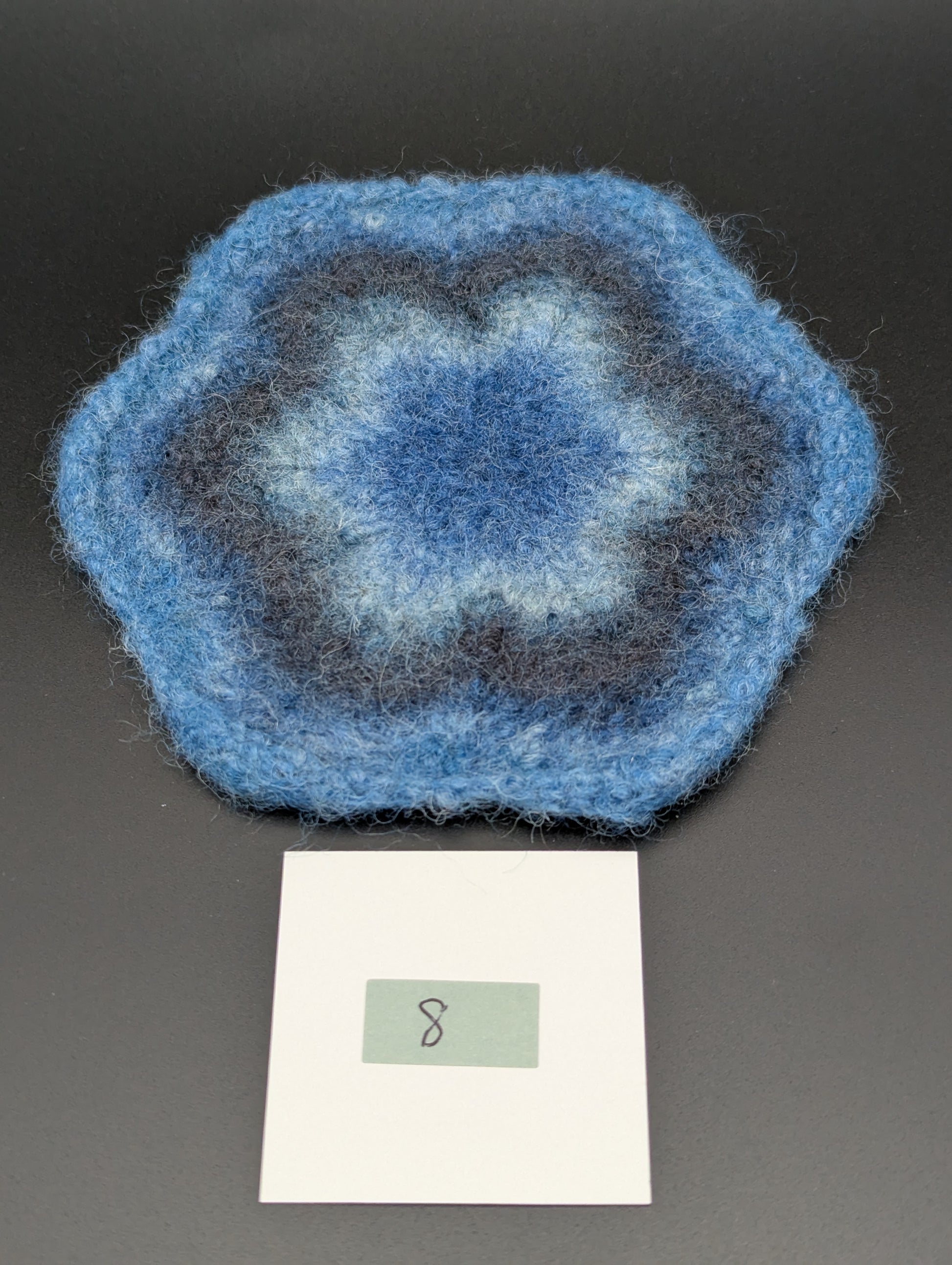 Blue hand knitted and felted coaster. This coaster is number 8.