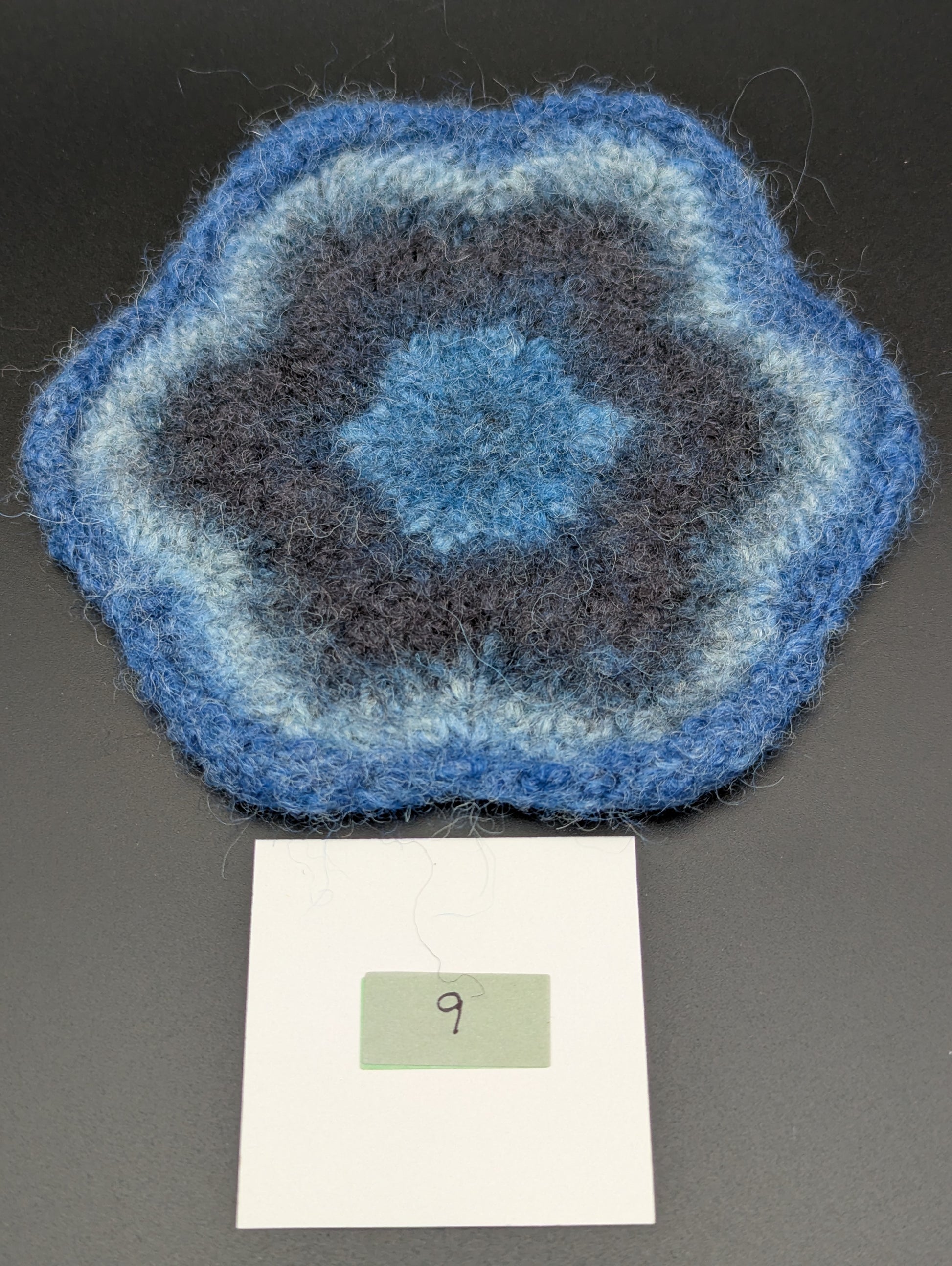 Blue hand knitted and felted coaster. This coaster is number 9.