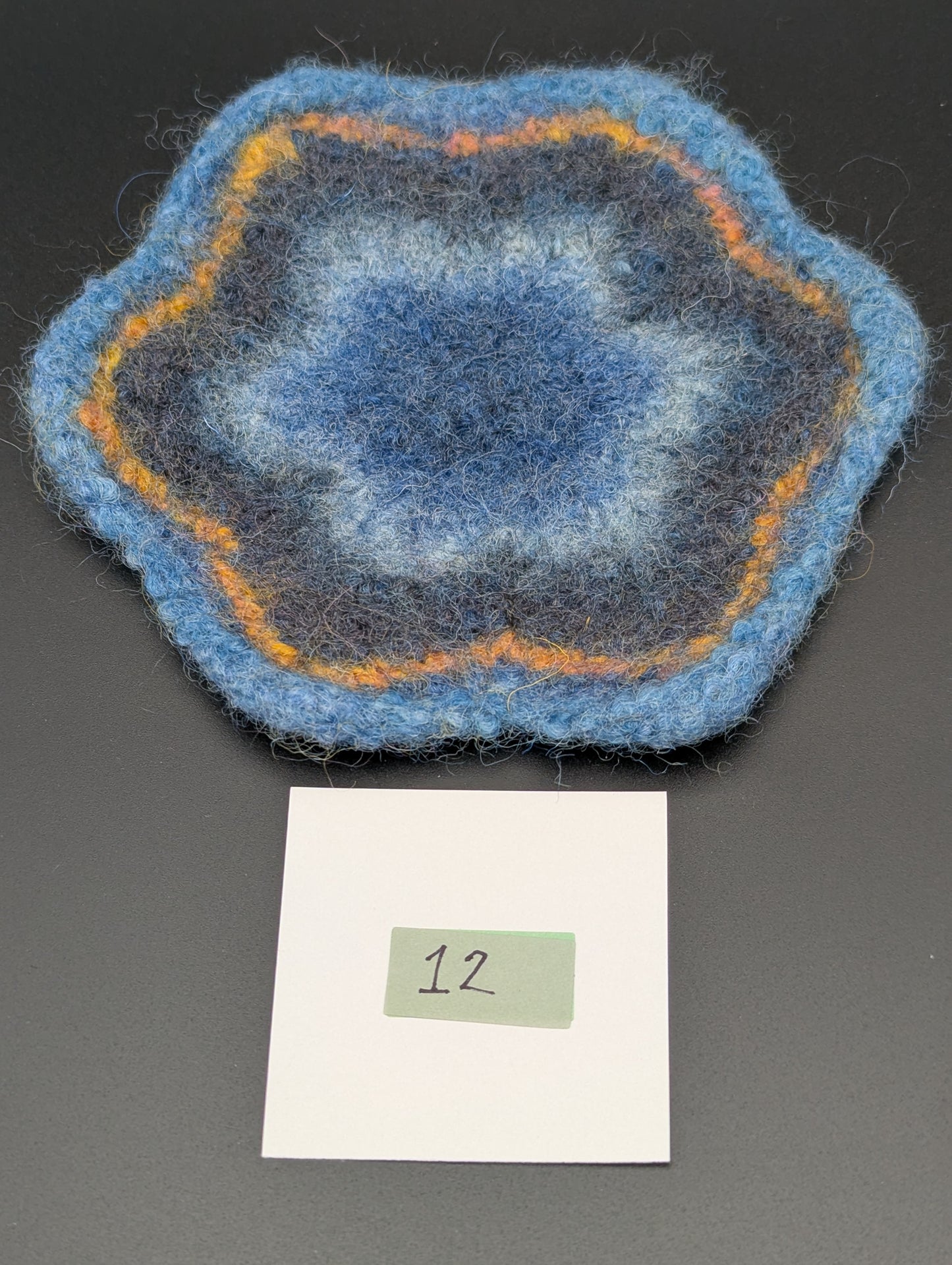 Blue hand knitted and felted coaster. This coaster is number 12.