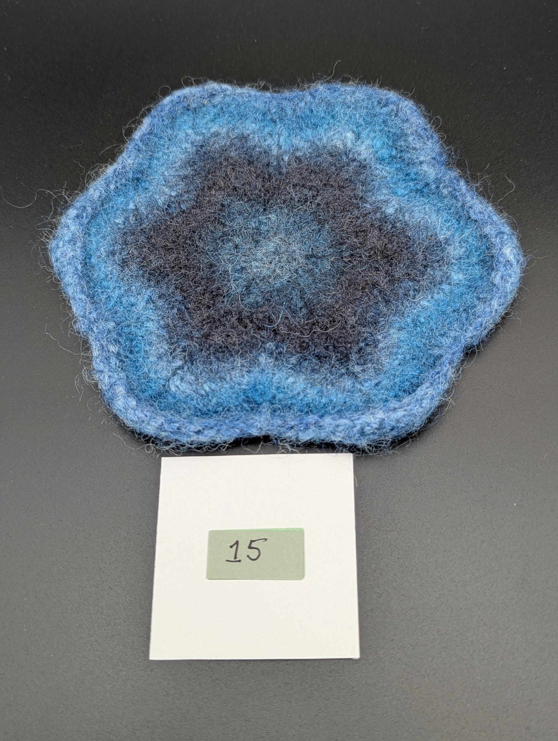 Blue hand knitted and felted coaster. This coaster is number 15.