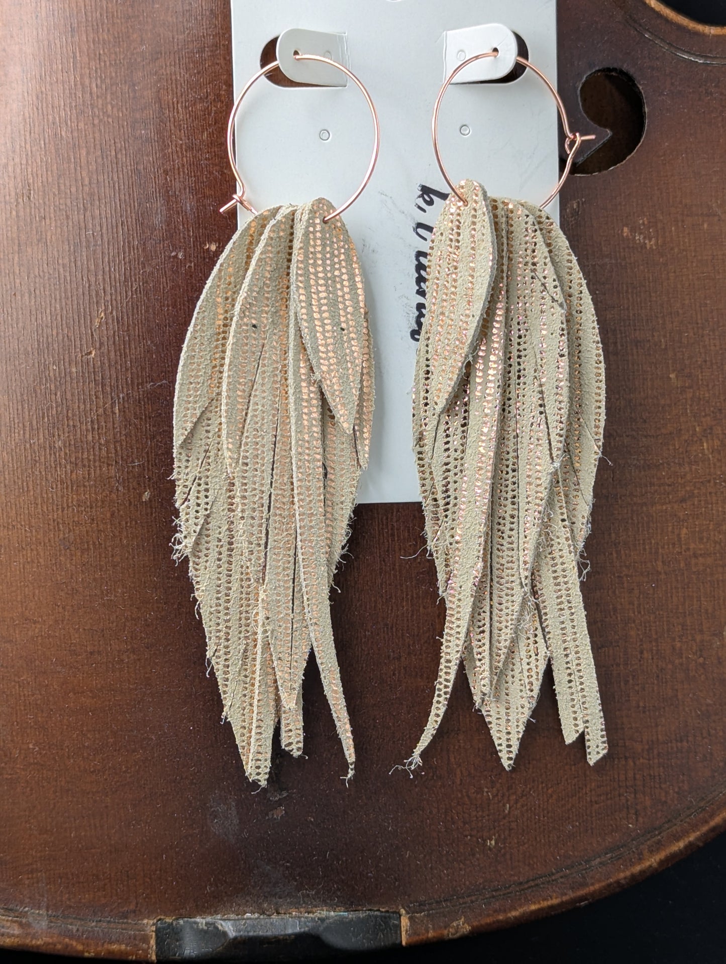 Leather earrings. Feather shaped, cream and gold with rose gold hoops. 4.5 inches long