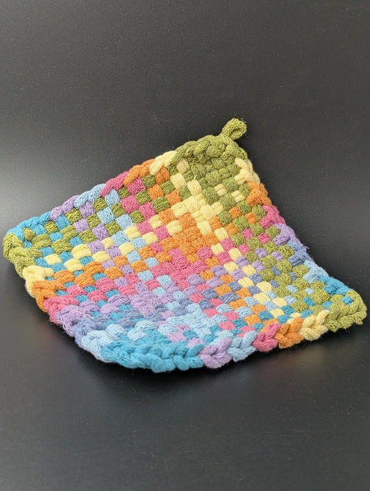 colorful woven potholder in shades of blue, pink, yellow, green and orange