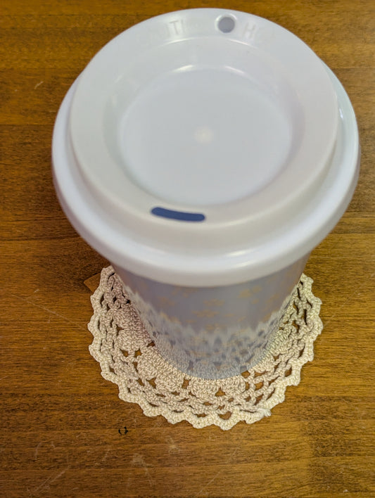 two tone crochet coaster with a mug for example