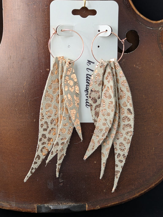 Leather earrings. Feather shaped cream and gold with rose gold hoops. 4.5 inches long.