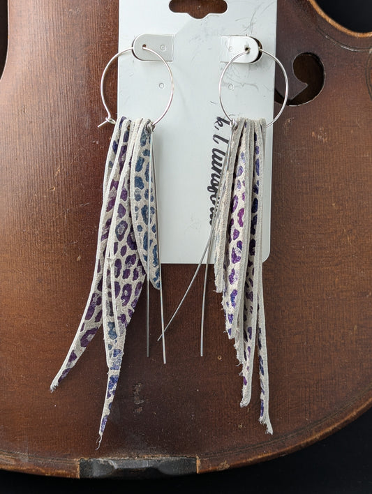 Leather earrings. Cream with purple, blue, gray, and green colors and silver accents on silver hoops. 5 inches long.
