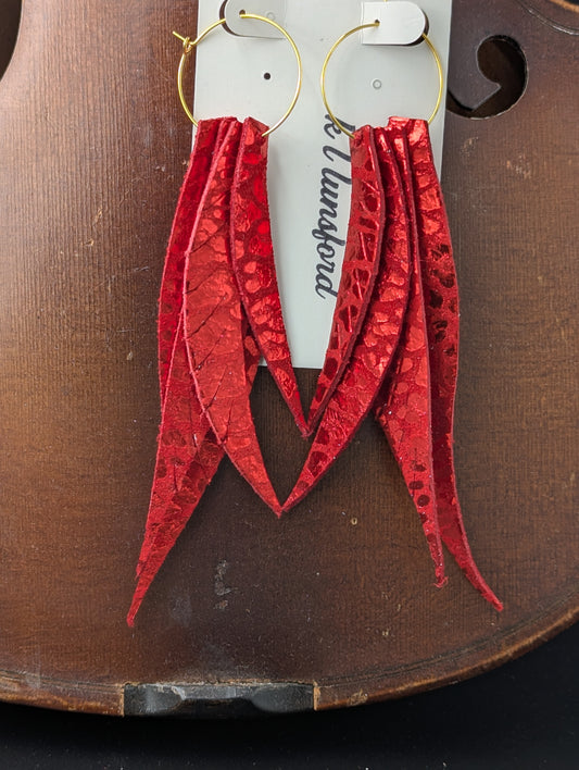 Leather leaf shaped earrings. Red with metallic red accents on gold hoops. 5 inches long.