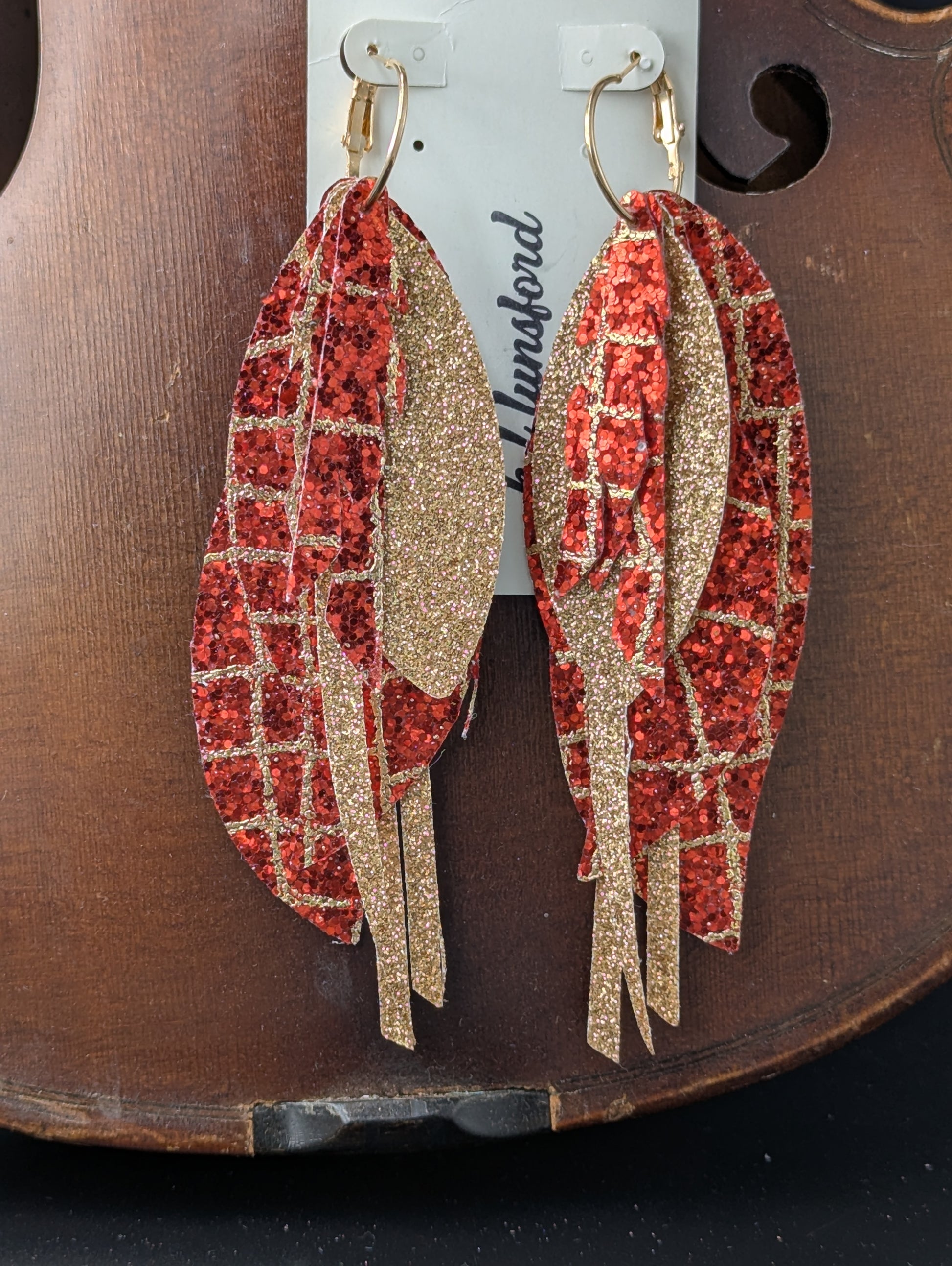 Vegan leather earrings. Sparkly red and gold with gold hoops. 5 inches long