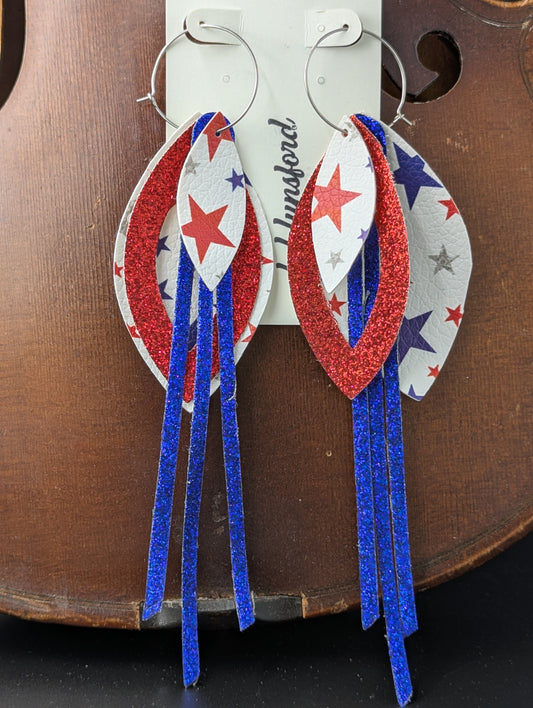 Leather earrings on silver hoops. Red, white and blue with sparkles and stars. 6 inches in length.