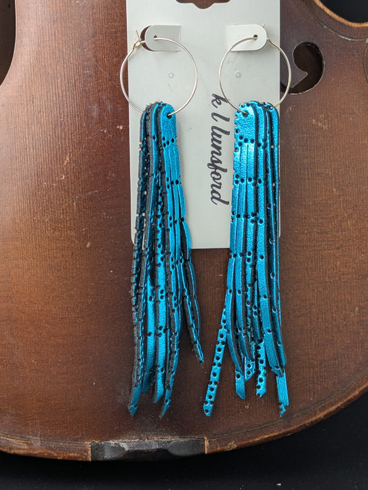 Leather earrings. Metallic turquoise with delicate holes on gold hoops. 5 inches long.