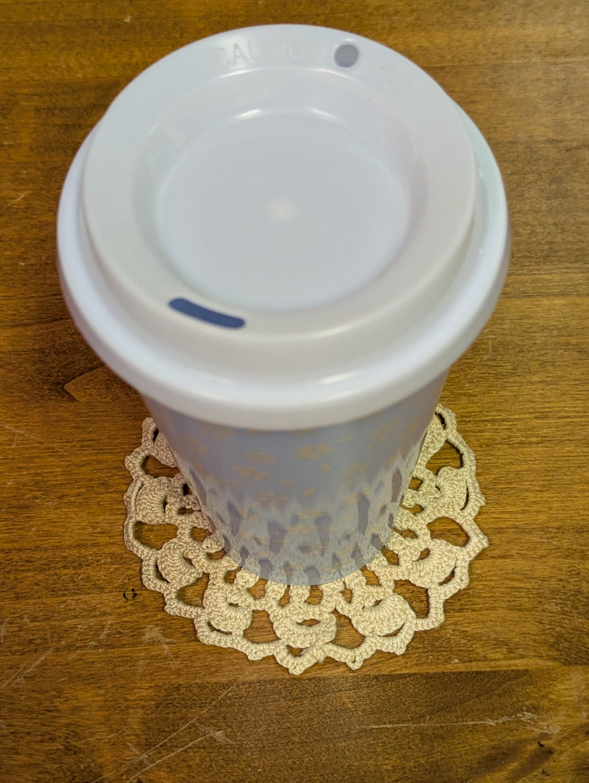 Crochet coaster with example mug
