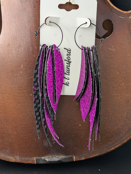 Leather earrings. Sparkly hot pink and isometric squares embossed on black leather with black hoops. 5 inches long.