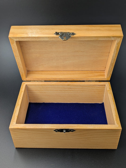 Wooden jewelry box with colorful hand-painted design and a blue felt interior