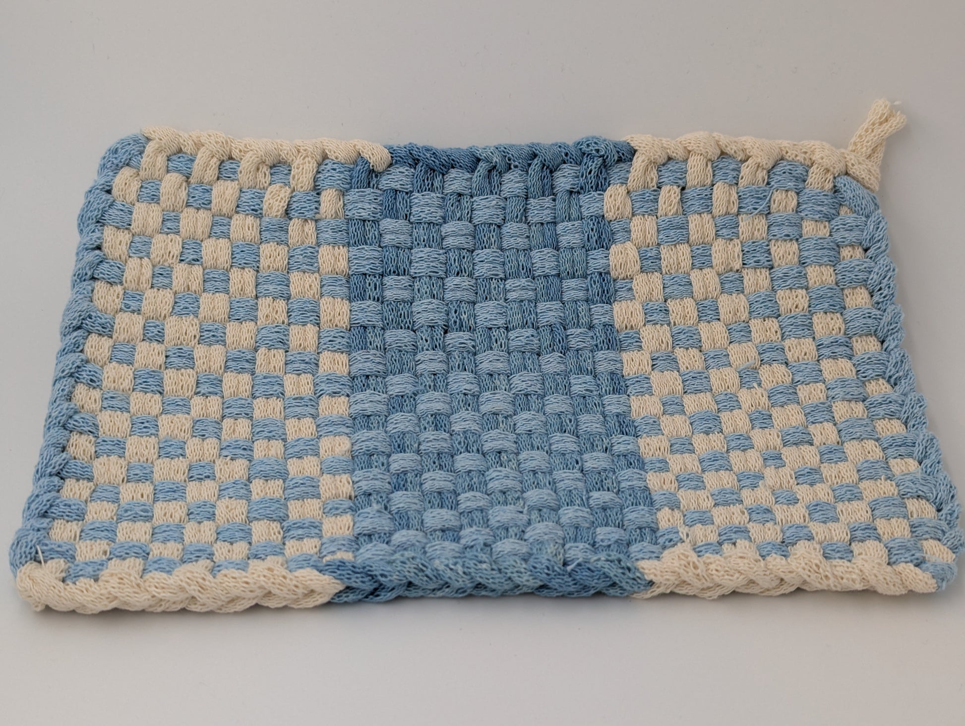 Oversize handwoven potholder in shades of blue and cream
